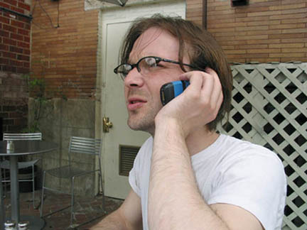 Bob looks serious when he makes mobil phone calls